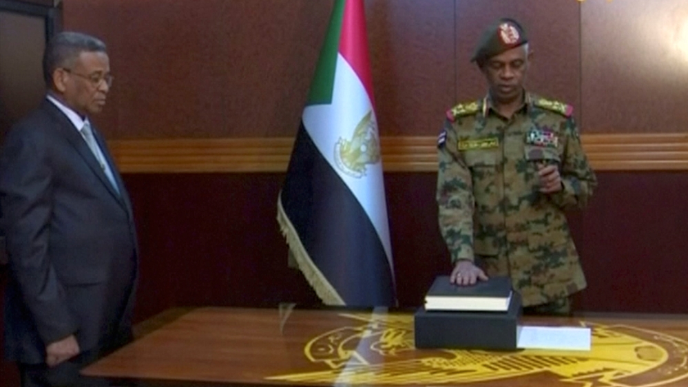 Ibn Auf being sworn in as head of the military council [Sudan TV via Reuters]