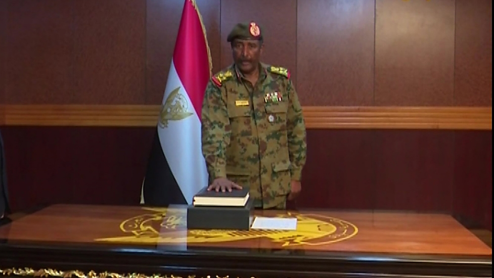 Al-Burhan takes oath as chief of the new military council on Friday [Sudan TV/AFP]