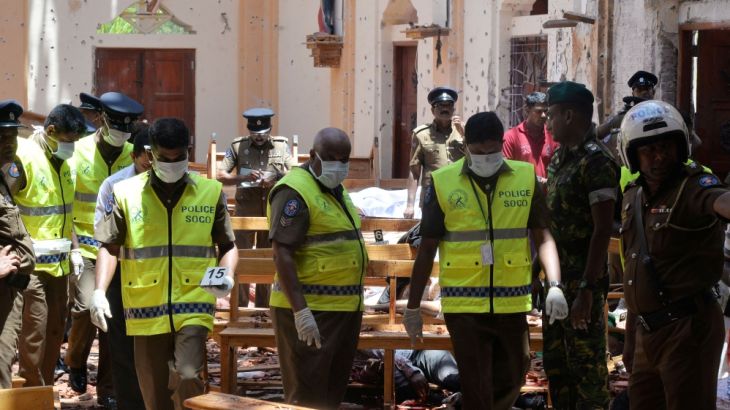 ATTENTION EDITORS - VISUAL COVERAGE OF SCENES OF INJURY OR DEATH Crime scene officials inspect the site of a bomb blast inside a church in Negombo, Sri Lanka April 21, 2019. REUTERS/Stringer NO RESALE