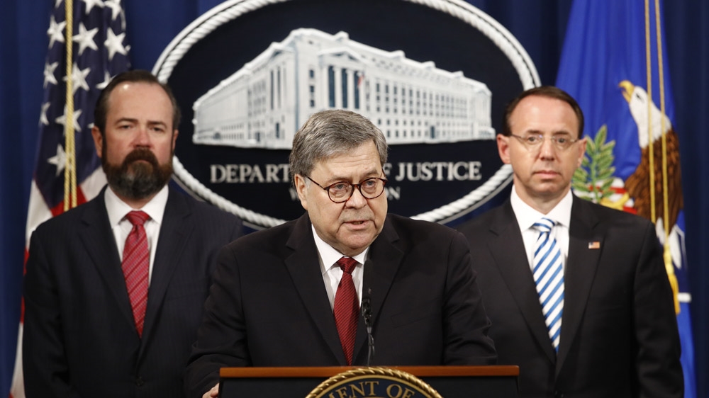 Attorney General William Barr speaks alongside Deputy Attorney General Rod Rosenstein, right, and Deputy Attorney General Ed O'Callaghan, left, about the release of a redacted version of Special Counsel Robert Mueller's report during a news conference [Patrick Semansky/AP]