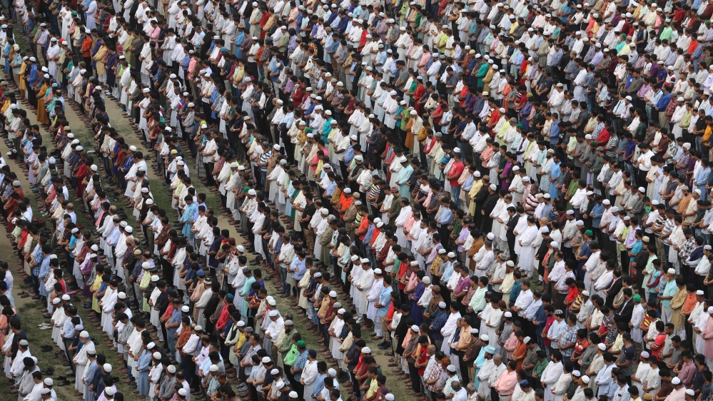 Bangladeshis offer funeral prayers for the Awami League leader's grandson in Dhaka [AFP]