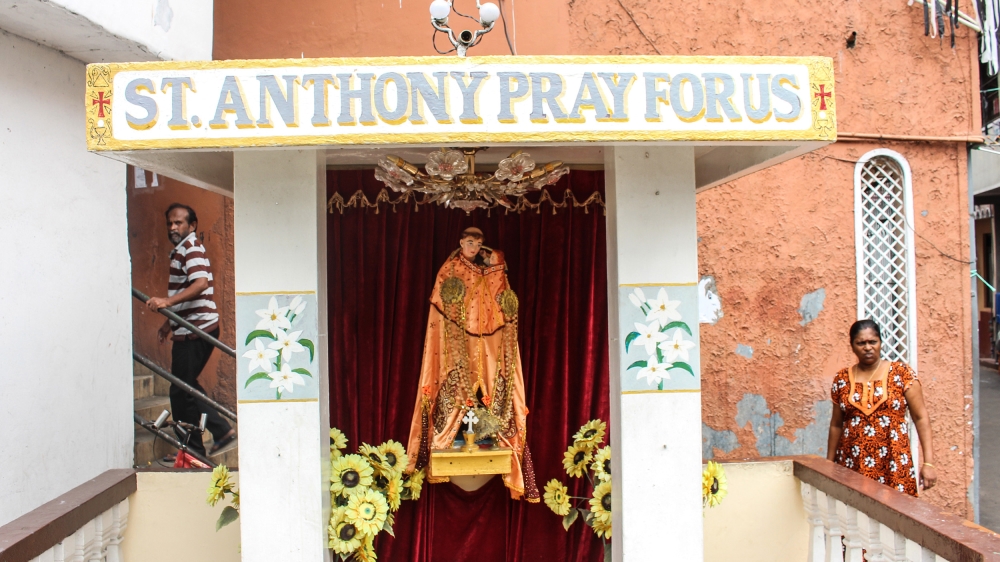 Shrines to St. Anthony can be found on street corners and at the entrance to alleyways in densely-populated parts of Colombo [Kate Mayberry/Al Jazeera]