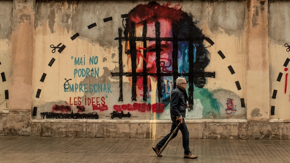 A mural of Jordi Cuixart, leader of Omnium Cultural, who has been in jail since 2017 awaiting trial for his role in the Catalan independence referendum [David Ramos/Getty Images]