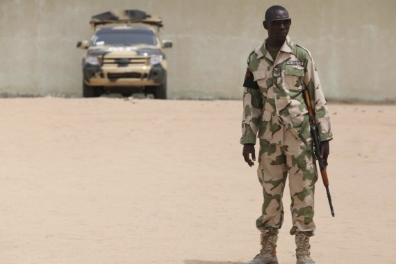 A soldier stands guard at a military base in Maiduguri, Nigeria