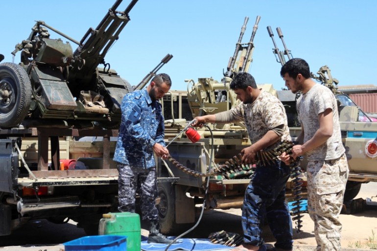 Members of Misrata forces, under the protection of Tripoli''s forces, prepare themselves to go to the front line in Tripoli