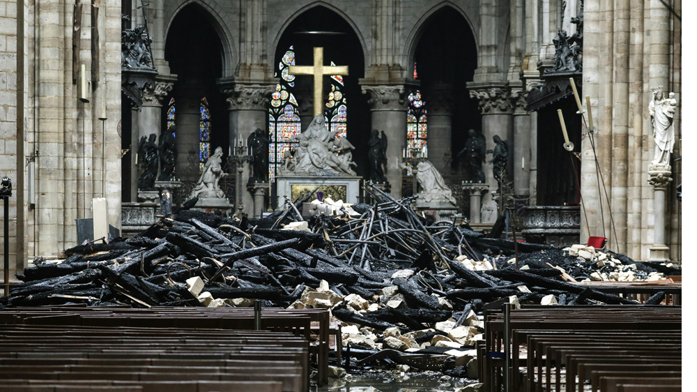
Relics and artwork were saved and the altar was still standing after the fire [Ludovic Marin/AFP]
