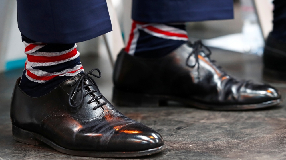 Farage donned patriotic socks for the launch event, held in a pro-Brexit English city [Eddie Keogh/Reuters]