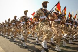 Members of the Iranian revolutionary guard march during a parade to commemorate the anniversary of the Iran-Iraq war (1980-88), in Tehran