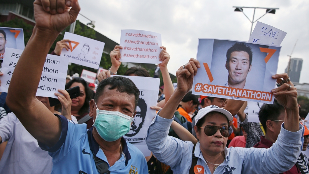 Supporters of Thanathorn react during his arrival at a police station in Bangkok [Athit Perawongmetha/Reuters]