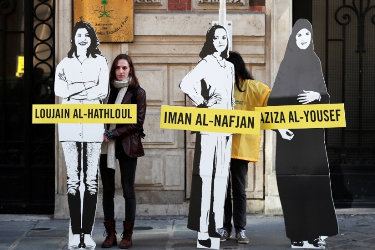 Demonstrators from Amnesty International protest outside the Saudi Arabian Embassy on International Women''s day in Paris