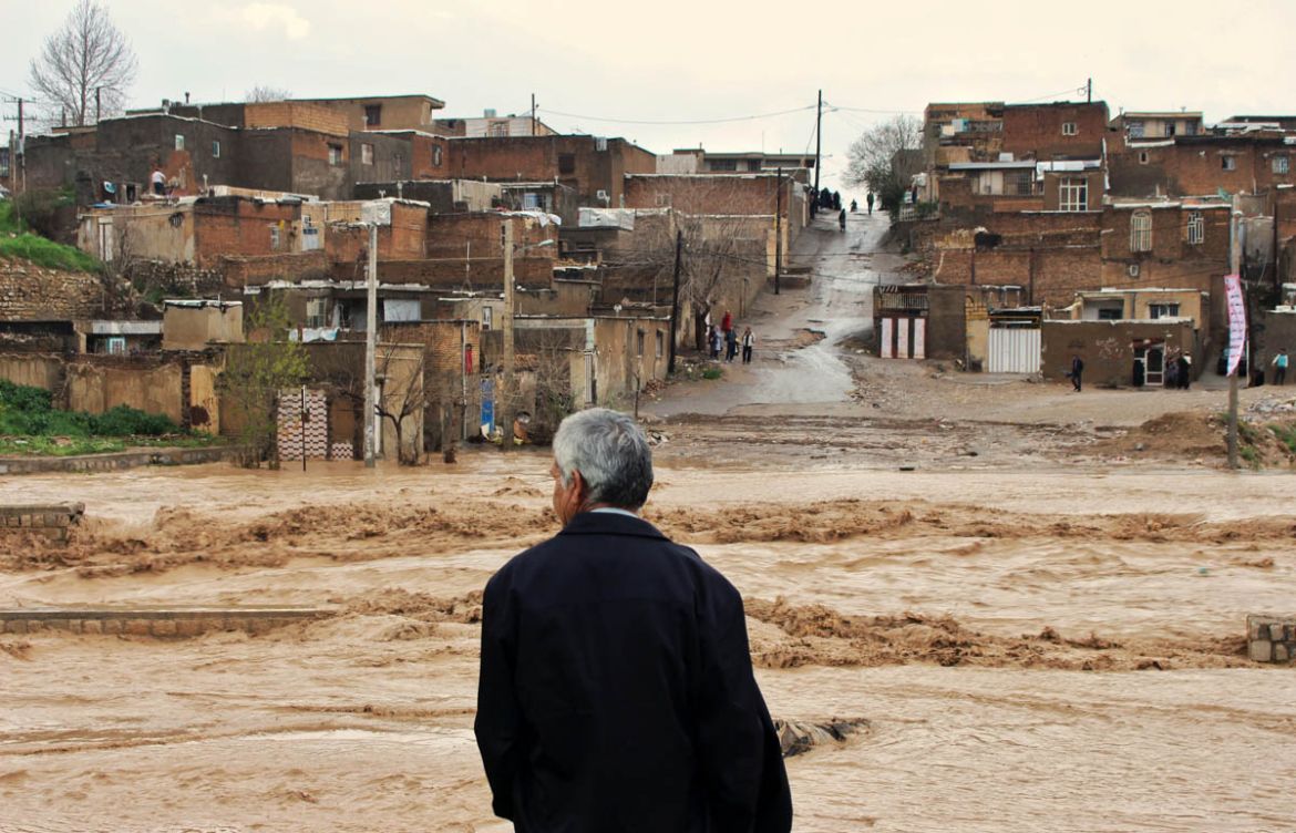 In this Monday, April 1, 2019 photo, a man watches as floodwaters hit the city of Khorramabad in the western province of Lorestan, Iran. Iran''s Foreign Minister Mohammad Javad Zarif tweeted late on Mo