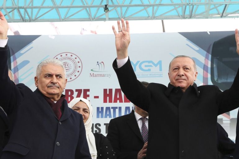 Turkey''s President Recep Tayyip Erdogan, right, and Binali Yildirim, the candidate of party for Istanbul Municipality, salute the supporters of his ruling Justice and Development Party, AKP, during a