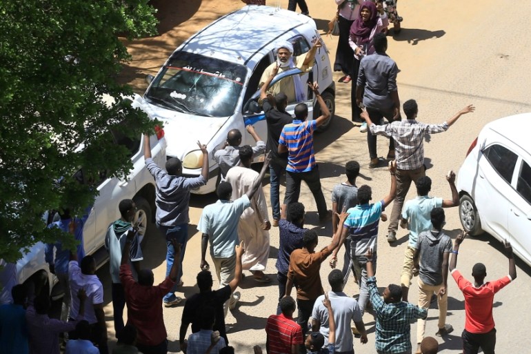 Sudanese demonstrators chant slogans during a protest demanding