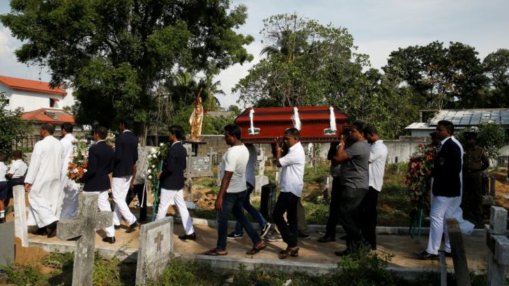 A coffin of a victim is carried, two days after a string of suicide bomb attacks on churches and luxury hotels across the island on Easter Sunday, in Negombo, Sri Lanka April 23, 2019