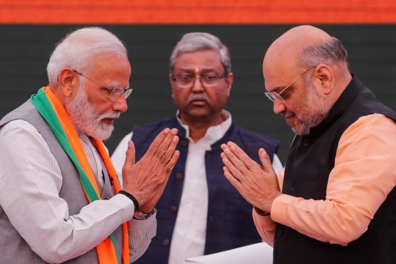 Indian Prime Minister Narendra Modi and chief of India''s ruling Bharatiya Janata Party (BJP) Amit Shah, greet each other before releasing their party''s election manifesto for the April/May general ele