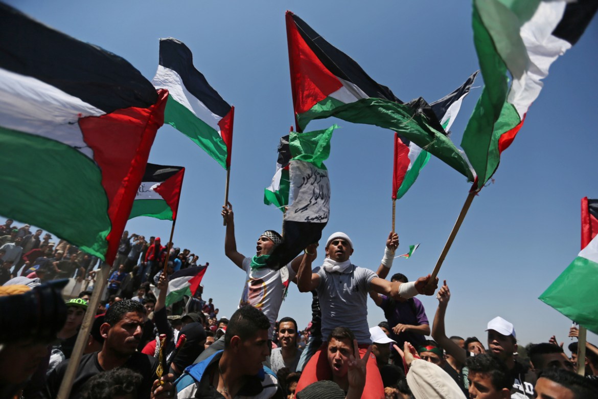 Demonstrators hold Palestinian flags during a protest marking the 71st anniversary of the ''Nakba'', or catastrophe, when hundreds of thousands fled or were forced from their homes in the war surroundin