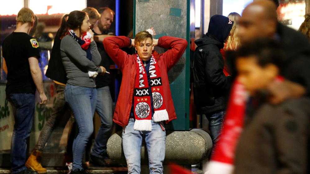 An Ajax fan in Amsterdam looks dejected after the match [Pascal Rossignol/Reuters]