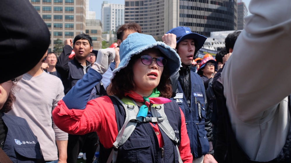 Cho Mi Yeon wants to remind the government of the reasons behind workers turning up to the demonstration on their day off [Sookyoung Lee/Al Jazeera]