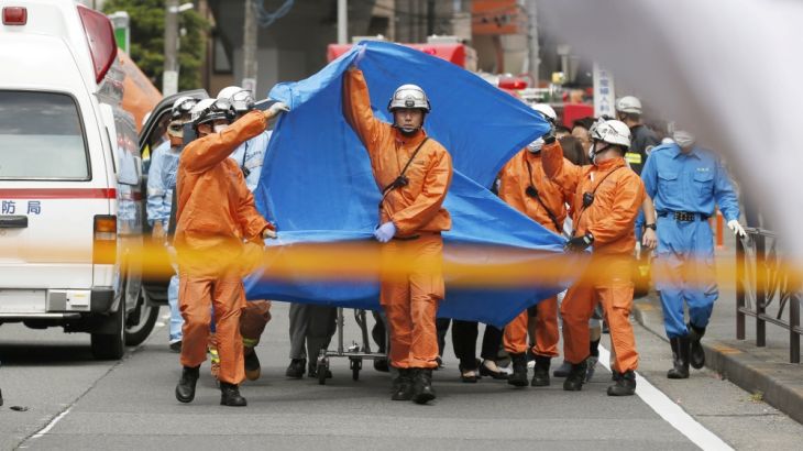 Rescue workers operate at the site where sixteen people were injured in a suspected stabbing by a man, in Kawasaki, Japan