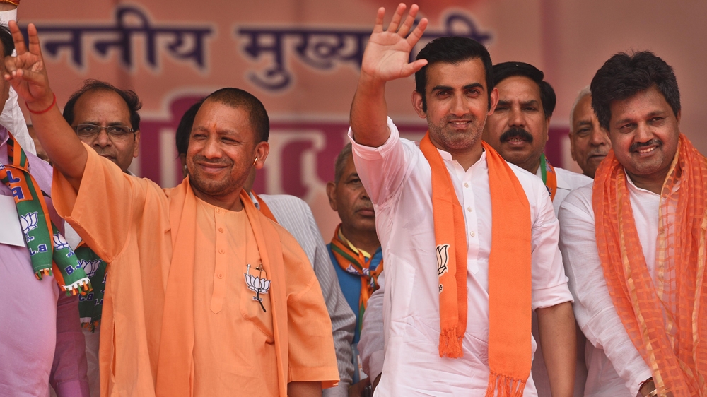 Gambhir with Uttar Pradesh state's Hindu monk Chief Minister Yogi Adityanath, left, at an election rally in New Delhi [Raj K Raj/Hindustan Times via Getty Images]