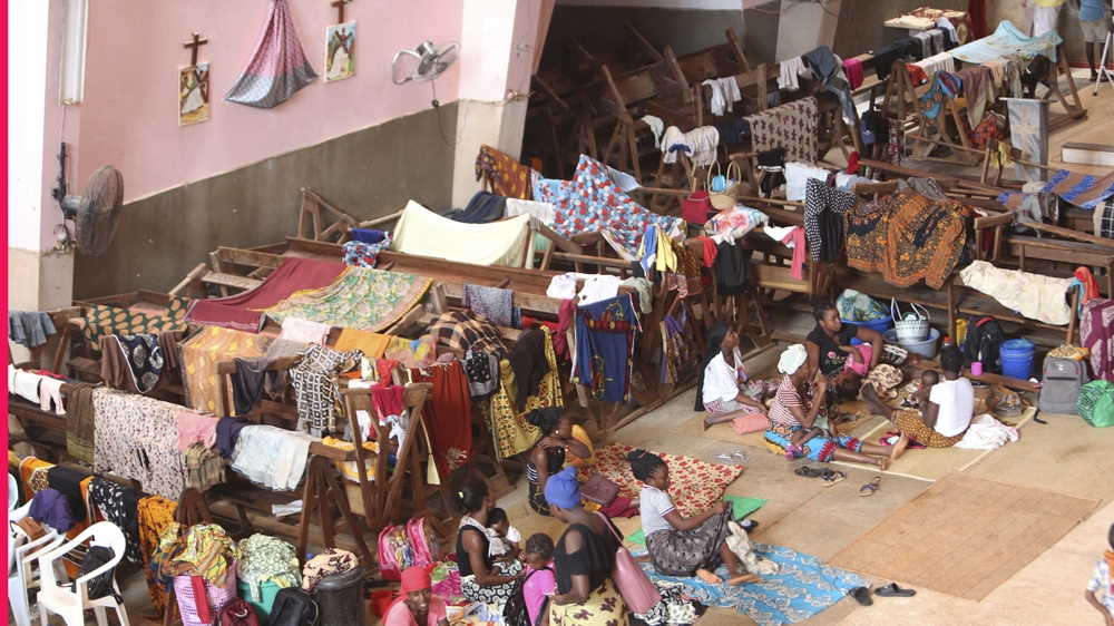 Benches turned into clotheslines inside the Maria Auxiladora parish [Tsvangirayi Mukwazhi/AP]