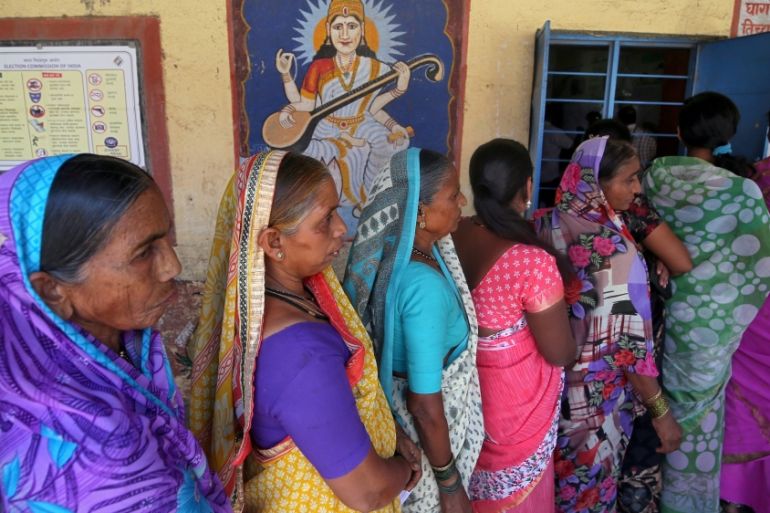 FILE PHOTO: Women wait to cast their votes at a polling station during the third phase of general election on the outskirts of Pune, India, April 23, 2019. REUTERS/Francis Mascarenhas/File Photo
