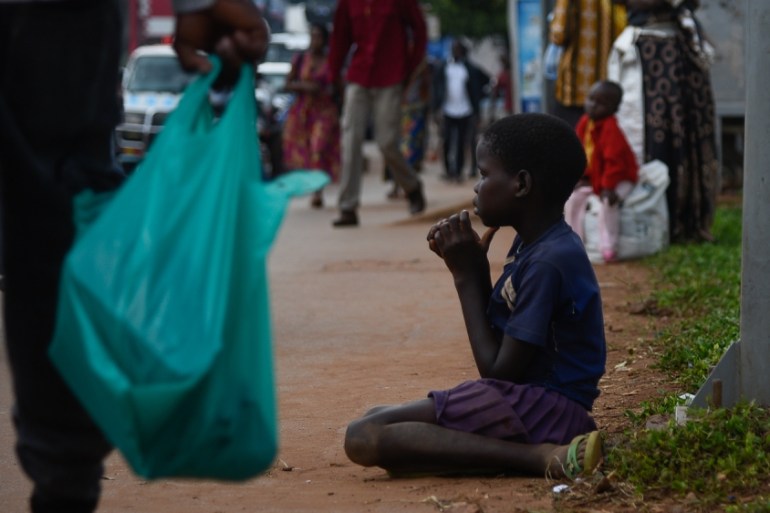 Kampala Street Children Gifts Ban [Isaac Kasamani/Al Jazeera]