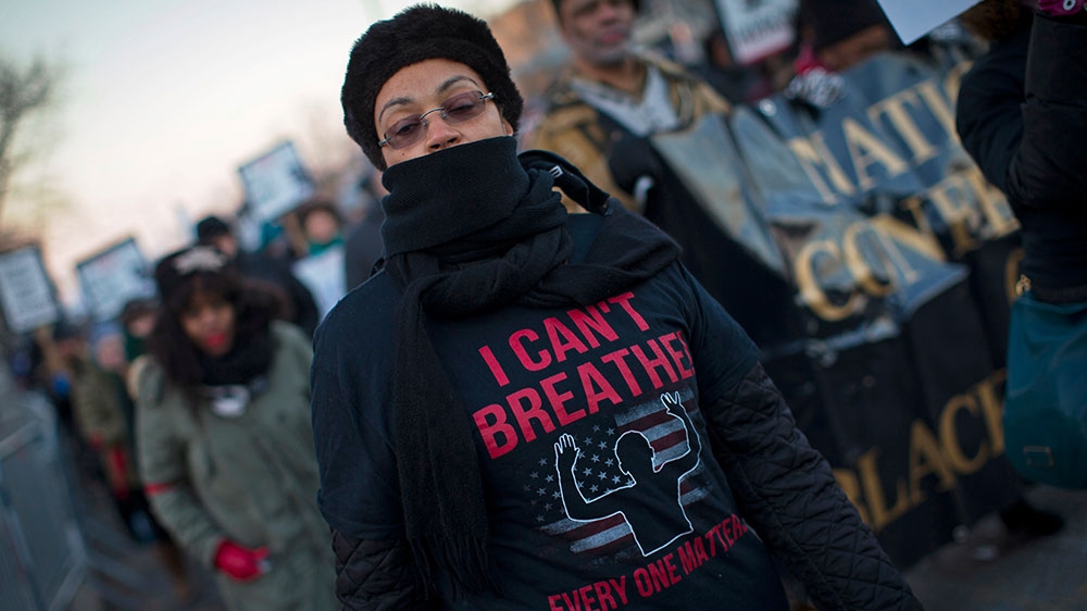 Demonstrators calling for justice in the death of Eric Garner take part in a protest march outside the 120th police precinct in the Staten Island borough of New York City [File: Mike Segar/Reuters]