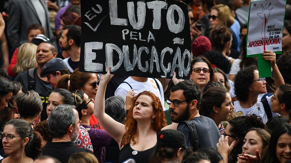 People demonstrate during a strike organised by National Students Union in Sao Paul [Nelson Almeida/AFP]
