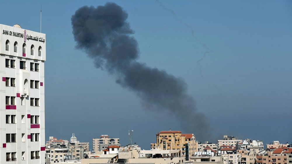 Smoke rises following an Israeli air strike in Gaza City [Suhaib Salem/Reuters]