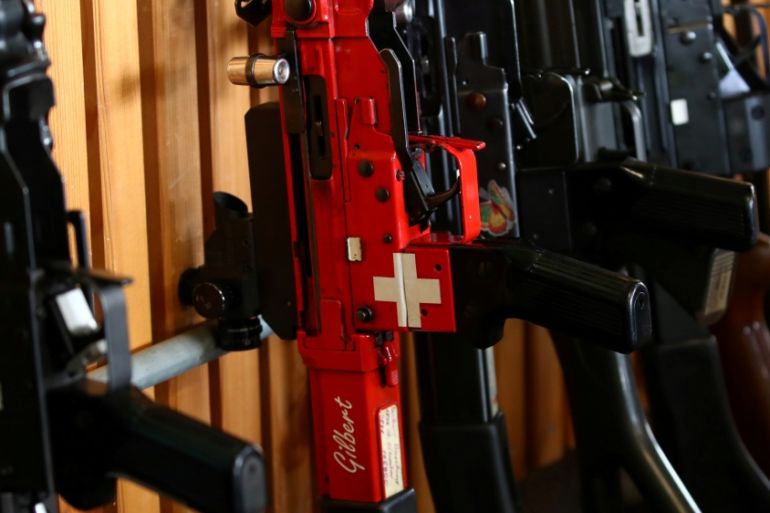 A rifle with a Swiss flag is pictured during a competition, ahead of a May 19 referendum on proposals to tighten weapon ownership laws in line with EU steps, in Romont, Switzerland May 11, 2019