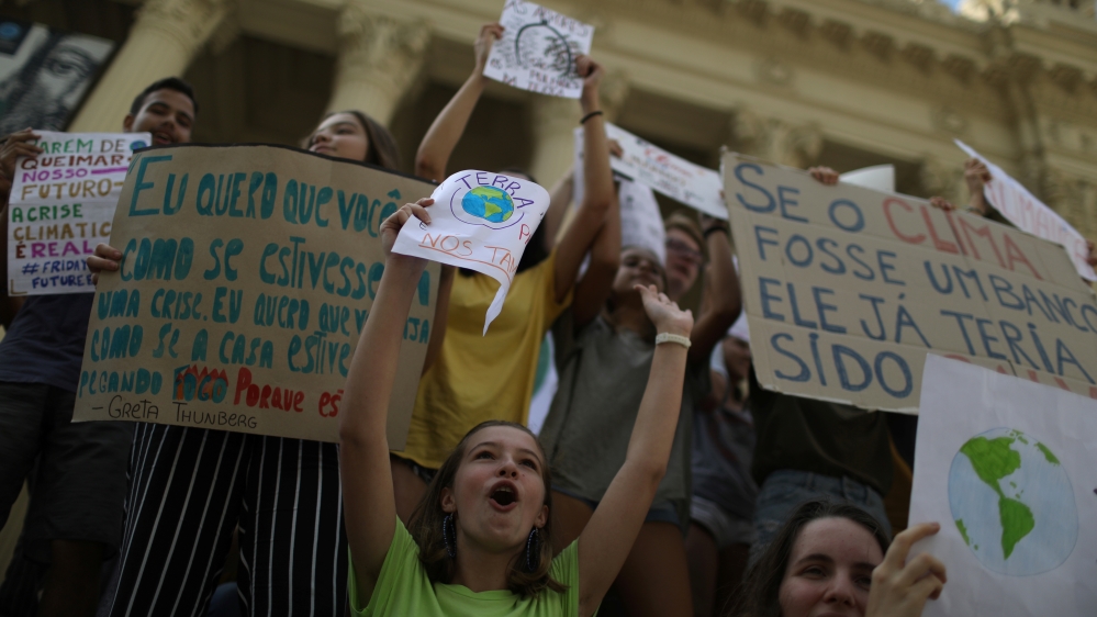 Demonstrators take part in the world march for climate change and the environment, called by the organization Fridays for Future outside the Rio de Janeiro State Assembly