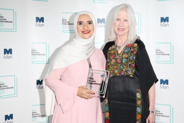 Author Jokha Alharthi (L) and translator Marilyn Booth pose after winning the Man Booker International Prize