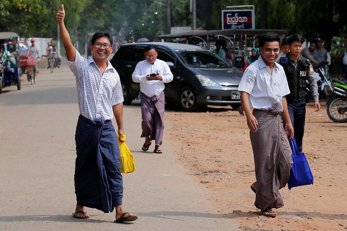 Reuters reporters Wa Lone and Kyaw Soe Oo gesture as they walk free outside Insein prison after receiving a presidential pardon in Yangon, Myanmar, May 7, 2019. REUTERS/Myat Thu Kyaw TPX IMAGES OF THE