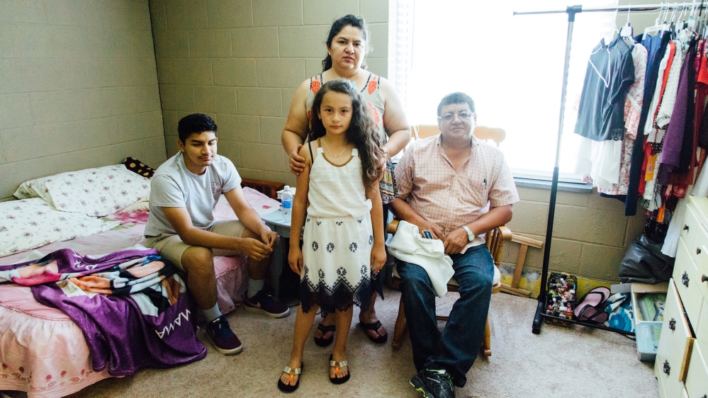 Juana stands with her granddaughter, Bridguette, her son, Carlitos, and her husband, Carlos [Pilar Timpane/Al Jazeera]
