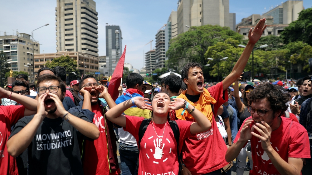 Supporters of Venezuelan opposition leader Juan Guaido rally against the government of Venezuela's President Nicolas Maduro [Manaure Quintero/Reuters]