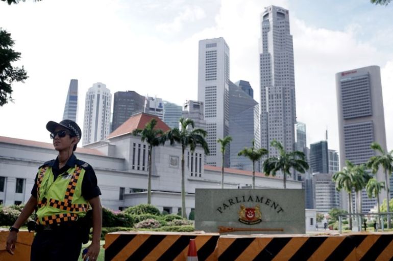 A police officer patrols the area surrounding Singapore''s Parliament House on Friday, Jan. 15, 2016, in Singapore.