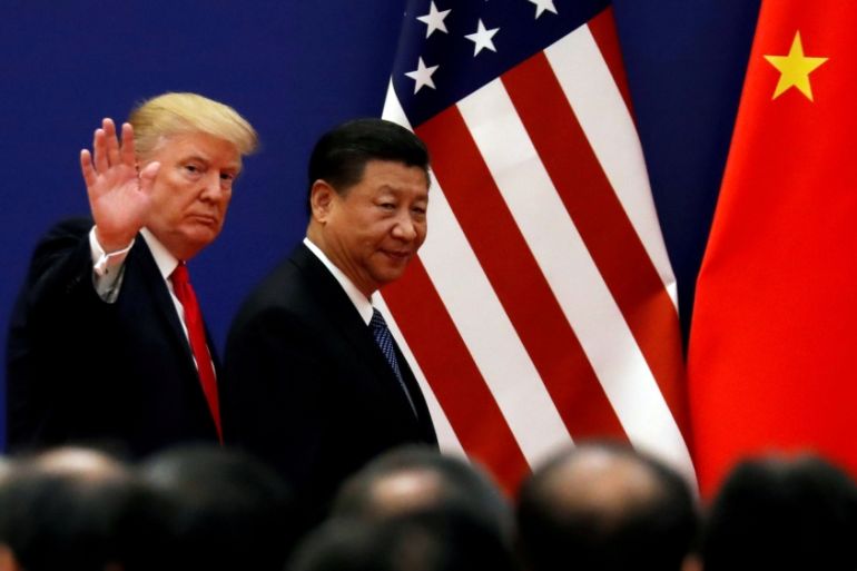 FILE PHOTO: U.S. President Donald Trump and China''s President Xi Jinping meet business leaders at the Great Hall of the People in Beijing