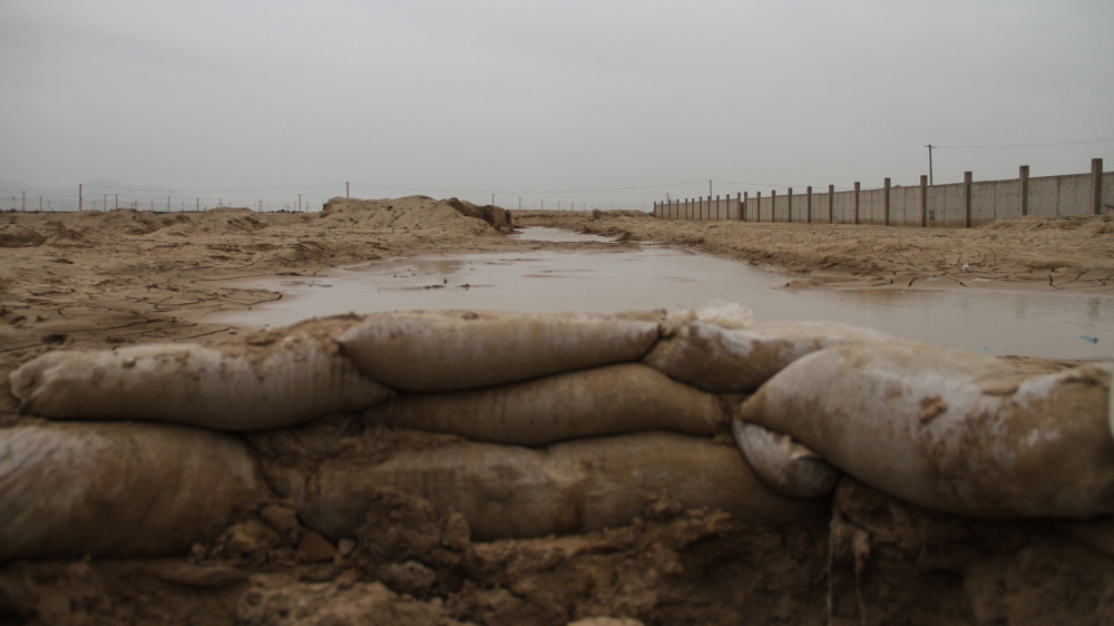 Antiflood bags did little to stop the damage in Kamp-e-Sakhi [Agnieszka Pikulicka-Wilczewska/Al Jazeera]