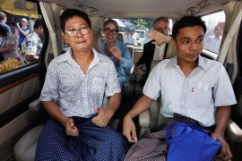 Reuters reporters Wa Lone and Kyaw Soe Oo react in a vehicle after being freed from Insein prison after receiving a presidential pardon in Yangon, Myanmar, May 7, 2019. REUTERS/Ann Wang