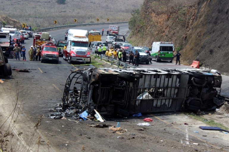 A general view shows the site where at least 20 people died in a fiery accident in the southeastern Mexican state of Veracruz when a bus collided with a cargo truck in the municipality of Maltrata