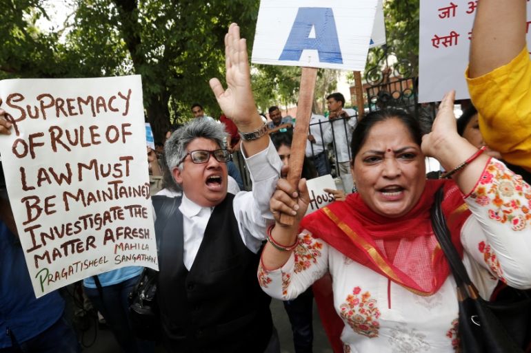 Demonstrators shout slogans during a protest after a panel of judges dismissed a sexual harassment complaint against Chief Justice of India (CJI) Ranjan Gogoi, outside Supreme Court in New Delhi