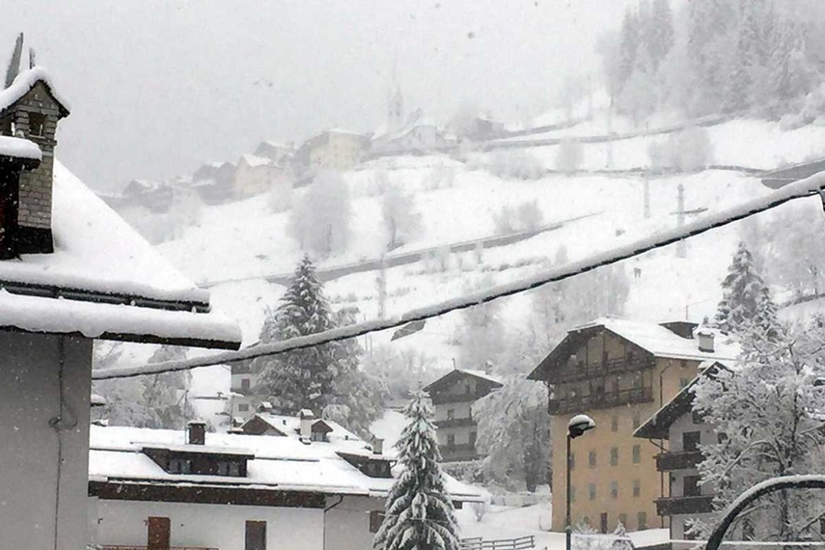 The snow covered village of Falcade after a snowfall in the Dolomites, northern Italy