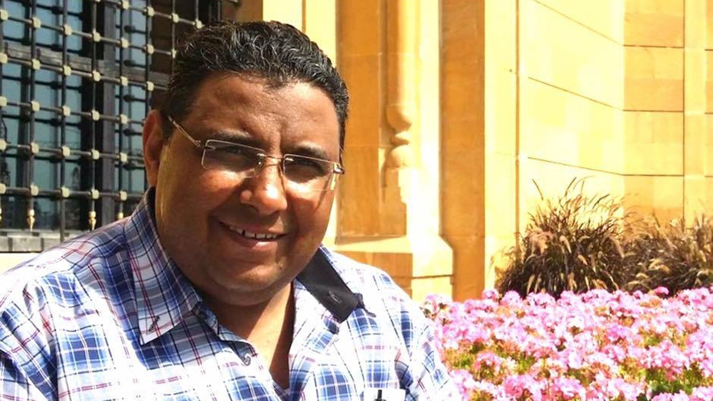 Mahmoud Hussein has been put in solitary confinement and denied his legal rights [Al Jazeera]