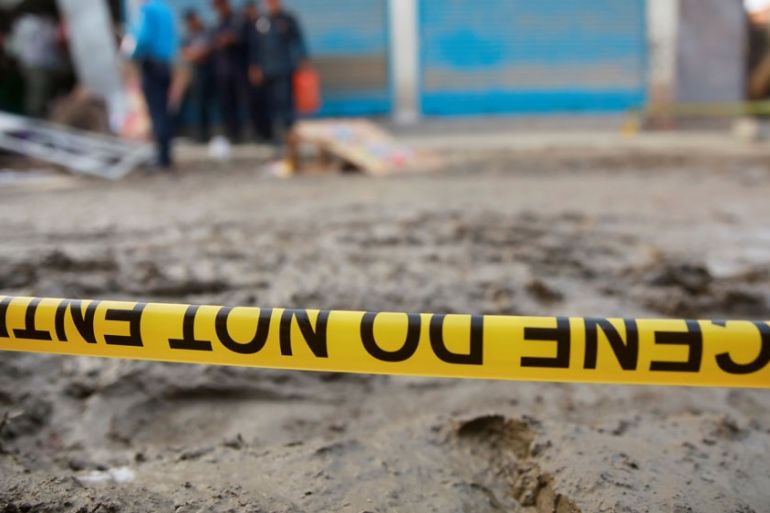 A police line tape secures the area of an explosion site in Kathmandu
