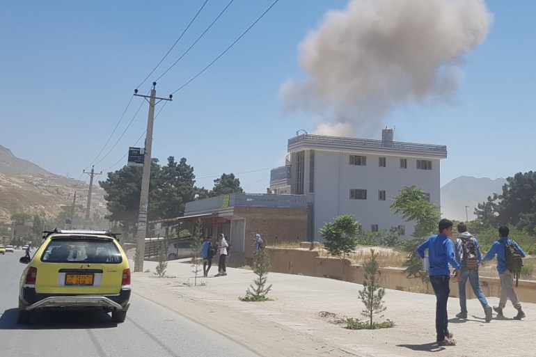 Smoke rises from the site of an attack in Pul-e-Khumri