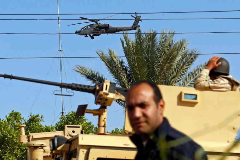 Military forces and helicopters secure an area in North Sinai, Egypt, December 1, 2017. Picture taken December 1, 2017. REUTERS/Mohamed Abd El Ghany -