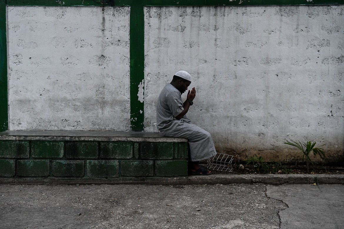A Muslim man offer prayers prior iftar, the meal after sunset, at the Masjid At-Tawheed mosque on the first day of the Muslim holy month of Ramadan in Port-au-Prince on May 6, 2019. Ramadan in Haiti b