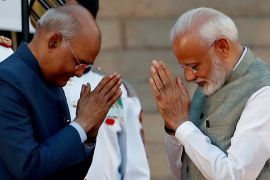 India''s President Ram Nath Kovind greets India''s Prime Minister Narendra Modi after his oath during a swearing-in ceremony at the presidential palace in New Delhi, India May 30, 2019