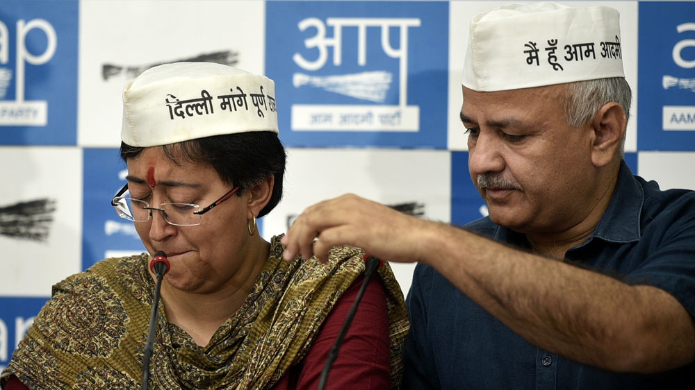 Atishi breaks down during a press conference with senior Aam Aadmi Party leader Manish Sisodia after a derogatory pamphlet was allegedly distributed by rival Gambhir's supporters [Biplov Bhuyan/Hindustan Times via Getty Images]